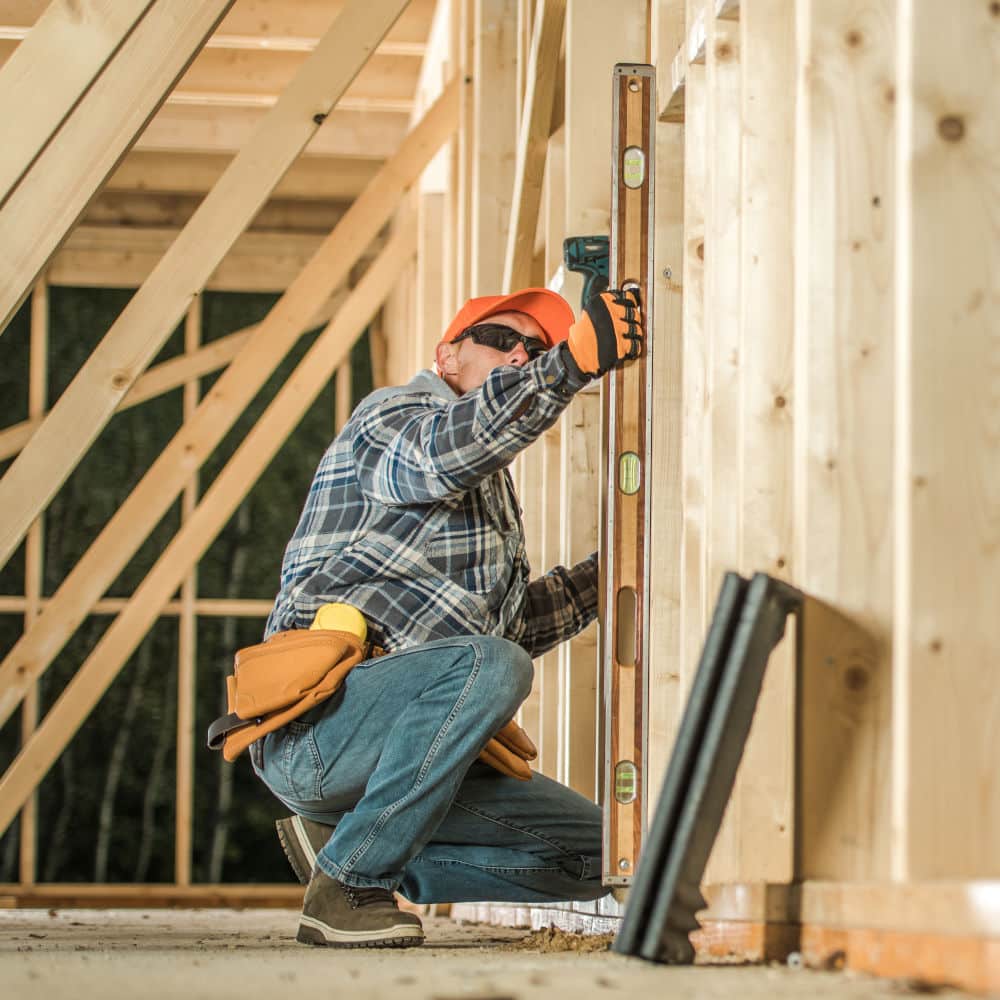 General contractor working on framing